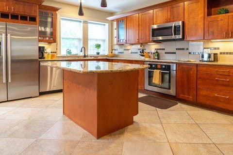 The large chef’s kitchen comes fully equipped with high-end appliances