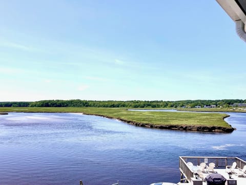 The beautiful view of the marsh from the common porch area, with Wells Beach just a 2 minute walk away