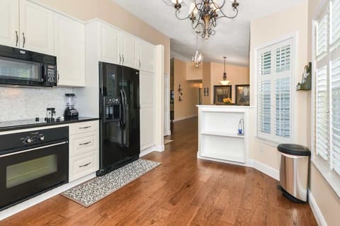 Beautiful, elegant & spacious kitchen stocked with everything you should need (probably a few things you don't)! Pots & pans, silverware, plates, bowls, cups, glasses, coffee mugs, wine glasses, blender, Keurig Duo, spice rack, knives, etc.