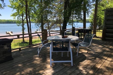 Large deck with two tables and a griddle 