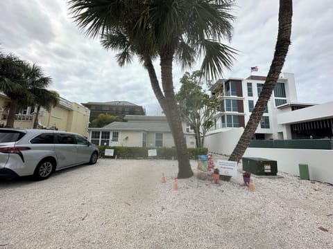 We are snuggled between new complex- close to beach access#3.  1945 Triplex 