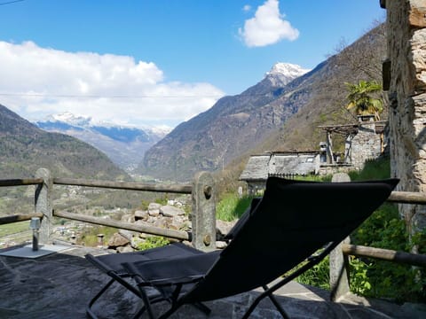 Cloud, Sky, Mountain, Plant, Property, Nature, Building, Highland, Outdoor Furniture, Natural Landscape