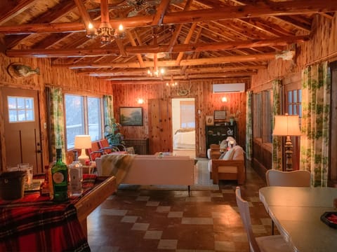 Great Room with original knotty pine and copper light fixtures