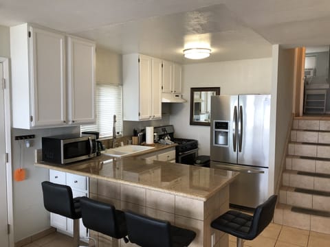 Kitchen is open to living room for easy socializing while watching the ocean
