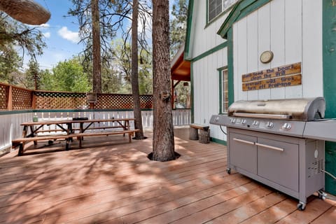 Private outdoor hot tub surrounded by tall pines, perfect for relaxing under the trees after a day of adventure—enjoy peaceful forest views, fresh air, and a truly rejuvenating stay.