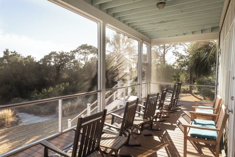 Screened in porch with ocean view.