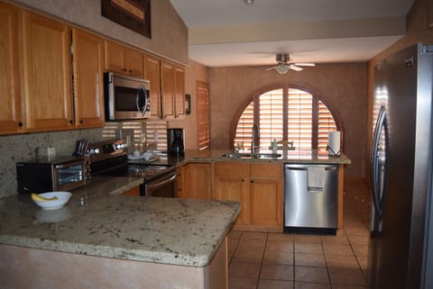 Kitchen is comfortable, roomy and nicely stocked w/ cooking and baking equipment