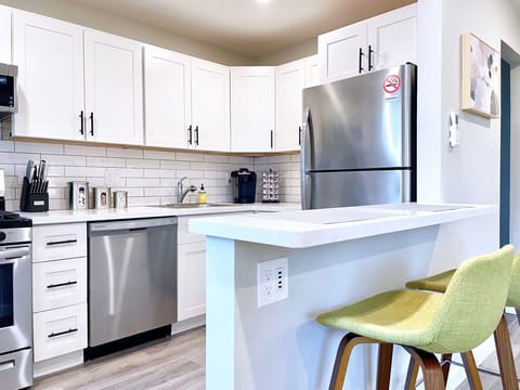 Remodeled Kitchen with quartz counters, and full-sized appliances.