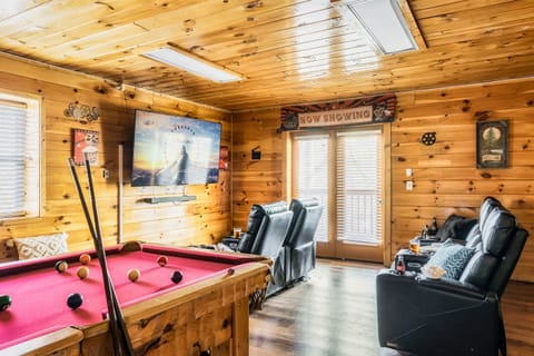 Get ready for unforgettable game nights, our game room with a pool table and big screen is the perfect spot for fun and friendly competition.