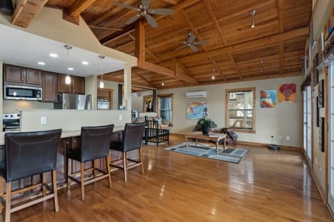 Main level. 2 french doors to deck. Spiral staircase to below. Spectacular views