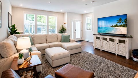 Bright, cozy living area with a Smart TV and natural light, perfect for relaxing after a day of exploring.