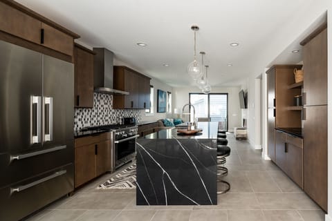 Open concept living, dining and kitchen area.