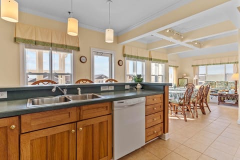 full kitchen, dining area and bar seating