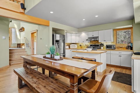 Generous indoor dining situated between the living and kitchen spaces