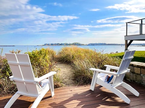 Year round seating looking into sandy path to the beach in November.