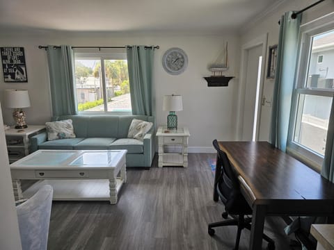Living Room with desk and kitchen view  
