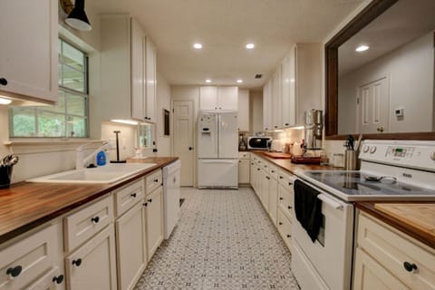 Newly renovated kitchen; covered porch off of kitchen; access left of fridge