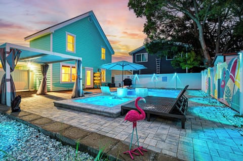 Come home when the pool's lit up and the sky's still pink at the edges — the view that makes the whole day worth it.