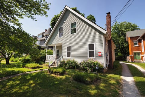 Front of house; Your entrance located down shared driveway & to the left. 
