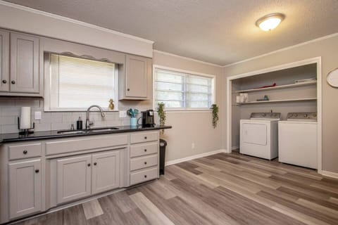 Clean and bright, fully stocked kitchen. Granite counter tops.