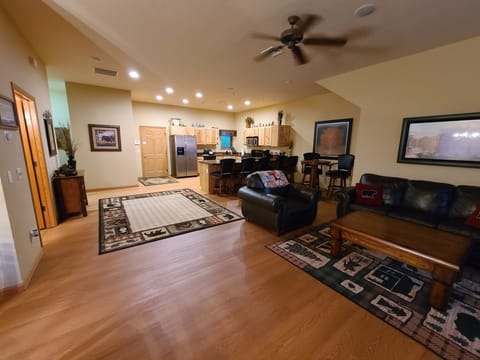 Panoramic view of open plan living room and kitchen.