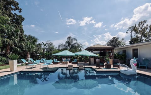 Sun soaked pool surrounded by palms and coastal breezes