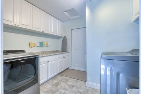 Laundry room with large washer and dryer