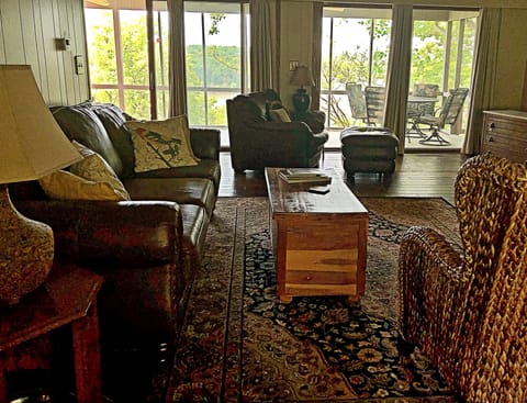 Spacious living room that opens up to the screened-in porch and lake view.