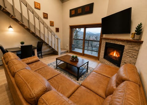 Take in the mountain views and relax in front of the fire in this luxury condo. 