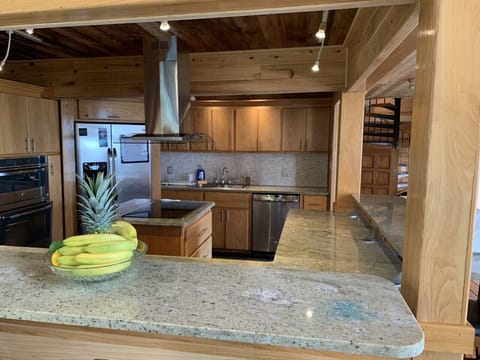 kitchen features cantilevered granite counter tops, opens to the great room