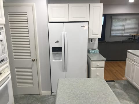 Refrigerator with ice maker; pantry closet to left