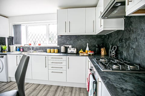 The fully equipped kitchen provides everything you need to prepare a delicious home-cooked meal, with modern appliances, ample cookware, and all the essential utensils to make cooking easy and enjoyable during your stay.