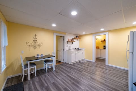 Eat-in kitchen with small table and chairs and sink