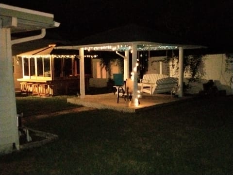 Our private backyard with covered hot tub and gazebo.