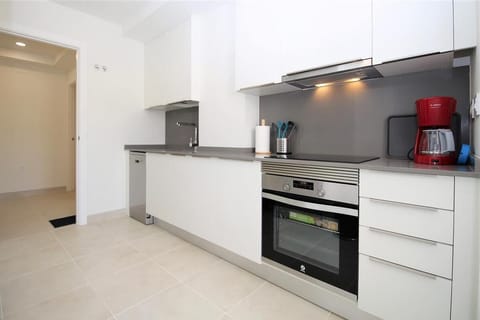 Another view of the fully fitted kitchen with quality appliances