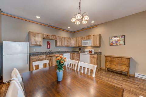 The large kitchen is well stocked with cooking and dining essentials and seats up to 10 guests.