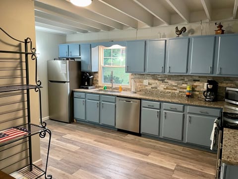 Kitchen has a regular coffee maker and a Keurig