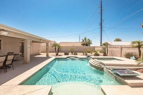 Amazing backyard complete with bar and grill area, outside fridge and more. 