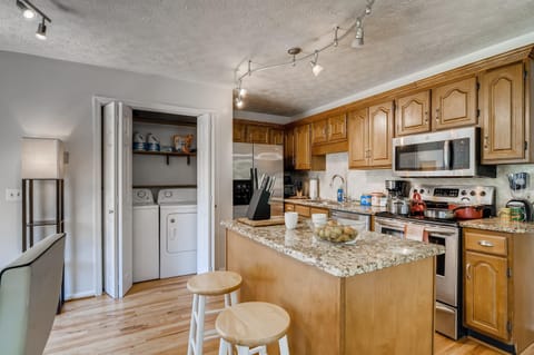 Cook, prepare, store, and serve food and drinks in the full size kitchen featuring many essentials.