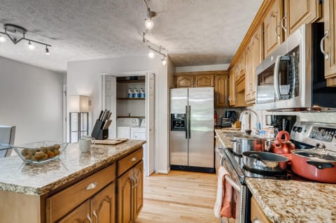 Cook, prepare, store, and serve food and drinks in the full size kitchen featuring many essentials.