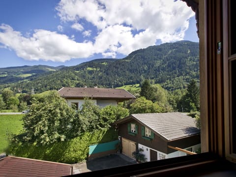 Cloud, Sky, Property, Building, Mountain, Window, Wood, Tree, Highland, Biome