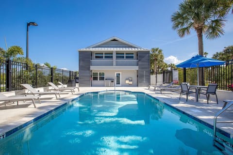 Dive into sunshine with loungers and a sparkling pool.