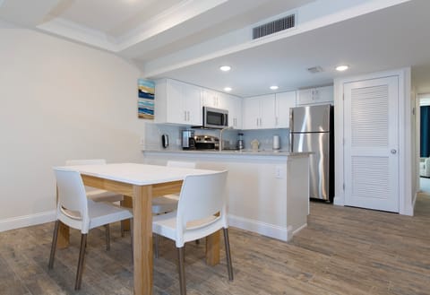 Plan beach-day snacks with dining and kitchen side-by-side.