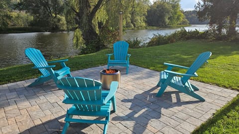 Backyard patio solo firepit overlooking the water.