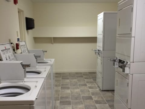Coin laundry at end of hallway