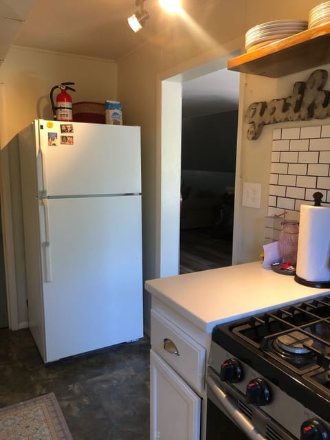 Full refrigerator with freezer on top.