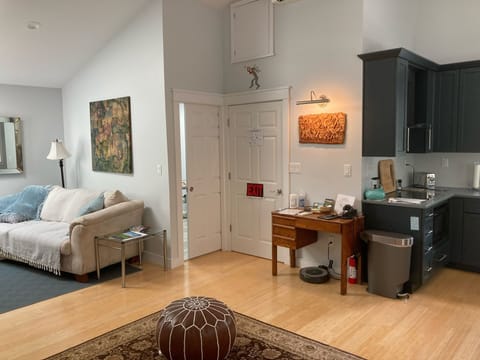 Entry way, with bathroom behind the sliding door.