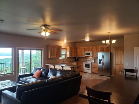 Livingroom, dining table for 8, bar seats 4, and kitchen