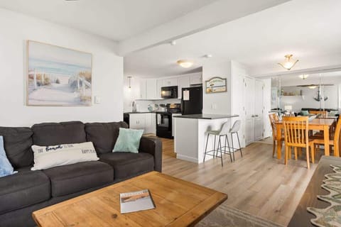 Living room, located right off the kitchen, standard couches (not sleeper sofas)