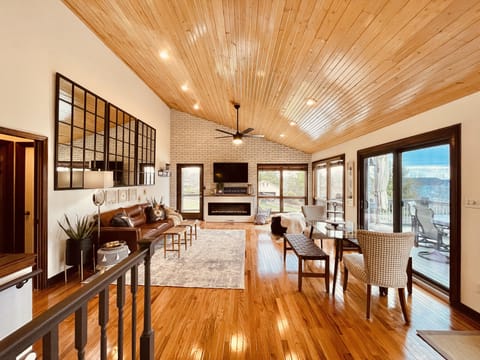 Great room, vaulted wood ceilings, open floor plan, tons of windows, lake views!